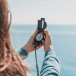 a woman consults a compass